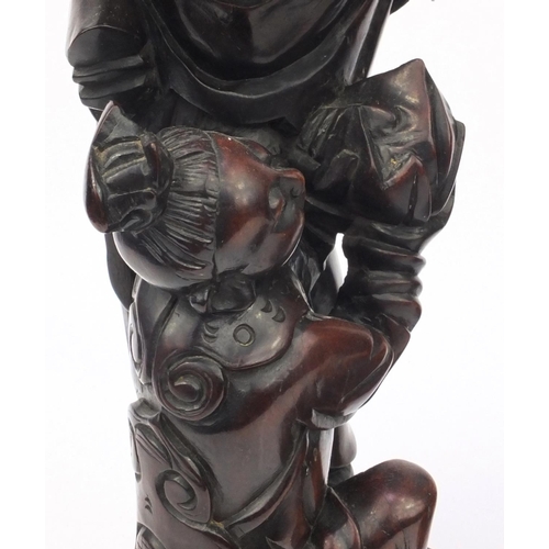 551 - Large pair of Chinese carved root figures, both of elders with children, the tallest 62cm high