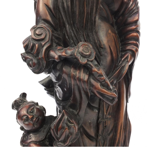 551 - Large pair of Chinese carved root figures, both of elders with children, the tallest 62cm high