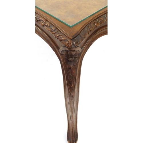 2059 - French stlye carved Burr Walnut coffee table with glass top, 48cm high x 104cm wide x 40cm deep