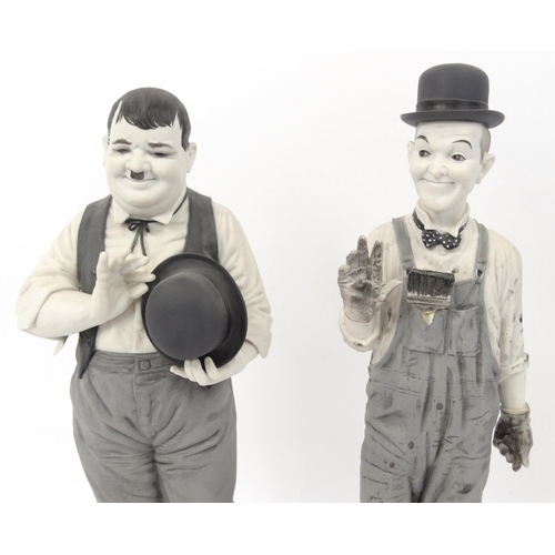 276 - A pair of limited edition Spanish porcelain Laurel and Hardy figures, number 147 and 150, the talles... 