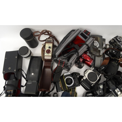 291 - Two boxes of assorted cameras lenses and accessories including Nikon, Minolta, Senton and Pentax exa... 