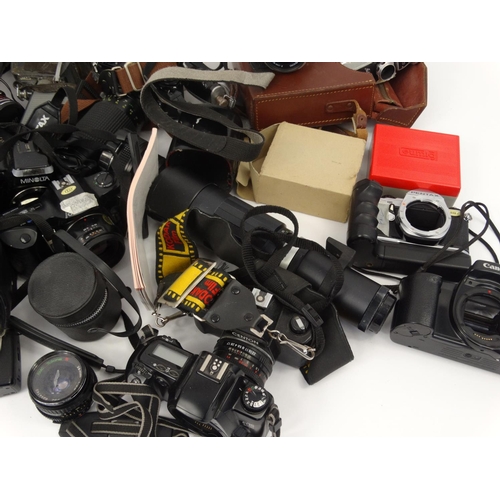 291 - Two boxes of assorted cameras lenses and accessories including Nikon, Minolta, Senton and Pentax exa... 