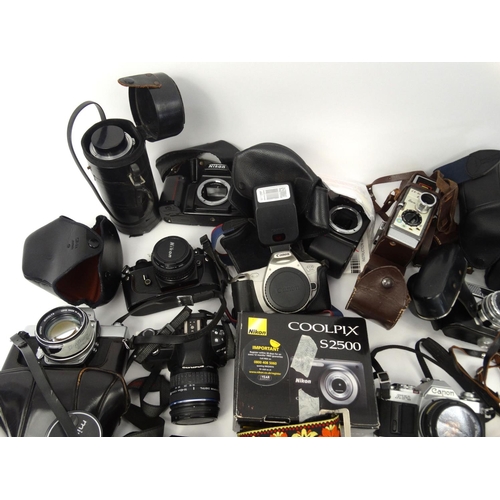 216 - Large selection of cameras, lenses and accessories including Cannon, Nikon, Vivitar and Kodak exampl... 