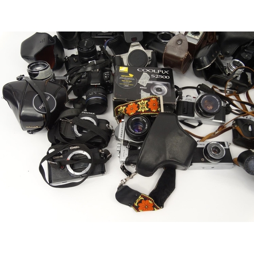 216 - Large selection of cameras, lenses and accessories including Cannon, Nikon, Vivitar and Kodak exampl... 