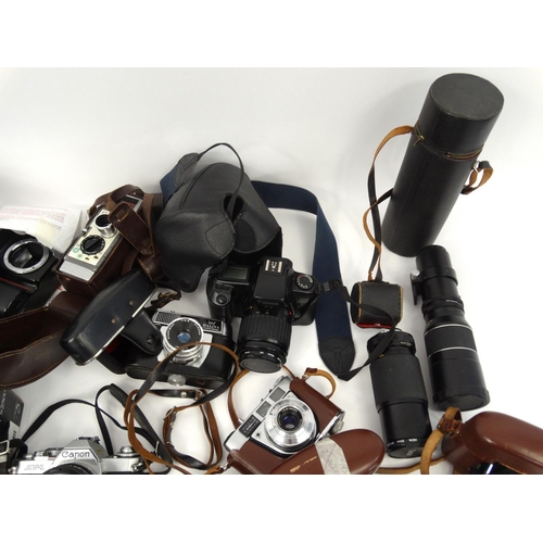 216 - Large selection of cameras, lenses and accessories including Cannon, Nikon, Vivitar and Kodak exampl... 