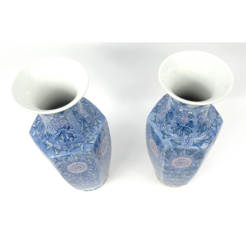 244 - Pair of decorative porcelain vases with floral decoration 46cm high