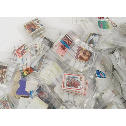 593 - Box of loose world stamps and Common wealth stamps