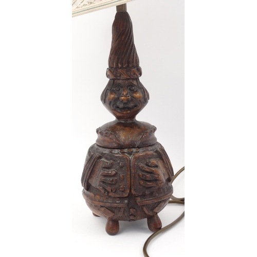 566 - Carved wooden figural table lamp