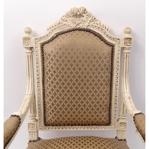 69 - French carved wooden elbow chair with beige upholstery