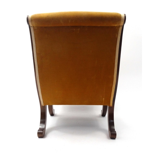 57 - Mahogany framed sleigh shaped bedroom chair with golden upholstery