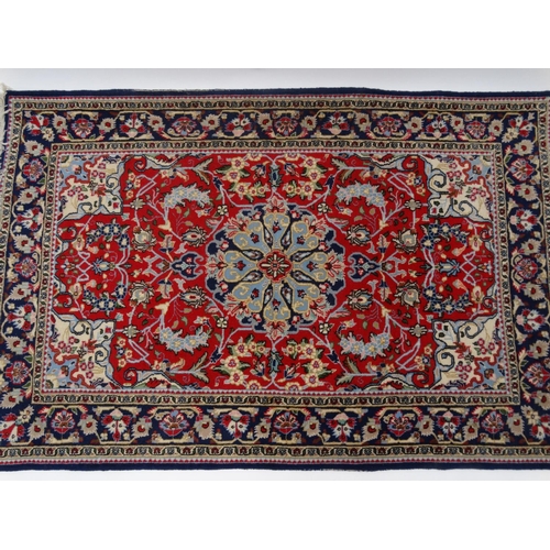 63 - Blue ground geometric floral patterned rug with Persian  rug world label, approximately 160cm x 107c... 