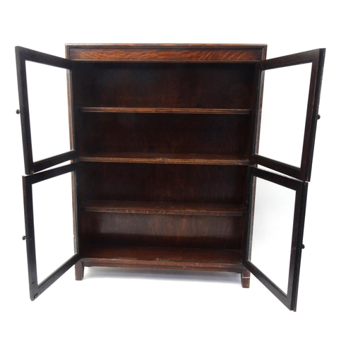 130 - Glazed oak stacking bookcase, 113cm high x 87cm wide x 20cm deep