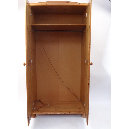 33 - Pine two door wardrobe, 187cm high x 97cm wide x 55cm deep