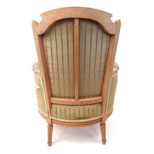 60 - Light wood open armchair with green striped upholstery