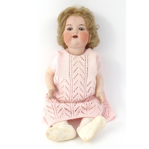 242 - Large bisque headed doll with composite jointed limbs, 50cm high