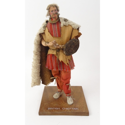 531 - Modern figure of a British Chieftain and a box set of four resin panels depicting classical figures ... 