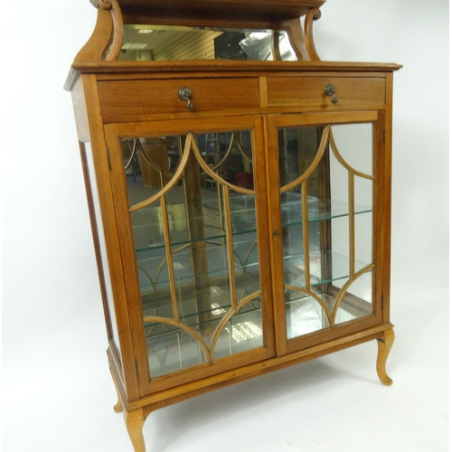 102 - Walnut display cabinet fitted with two frieze drawers and mirrored back, 140cm high x 91cm wide x 38... 