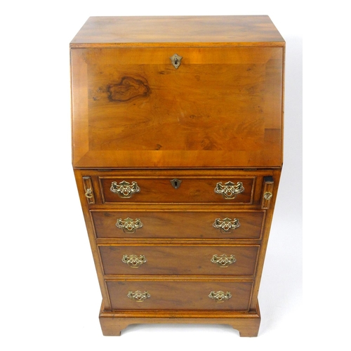 34 - Small yew wood bureau fitted with a fall above four drawers, 96cm high x 50cm wide x 40cm deep