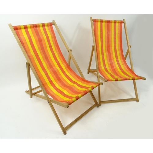 192 - Two vintage folding deckchairs