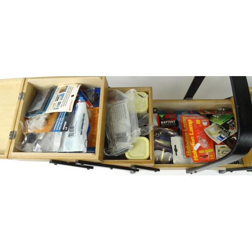 148 - 1950/60's cantilever sewing box, containing a selection of as new bulbs, furniture pads etc.