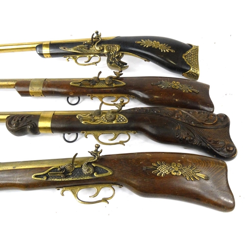 631 - Four decorative Blunderbuss guns, the larger 68cm long