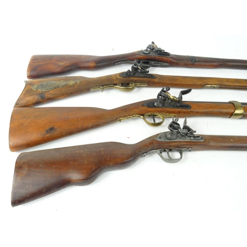 633 - Six decorative flint lock rifles, the larger approximately 112cm long