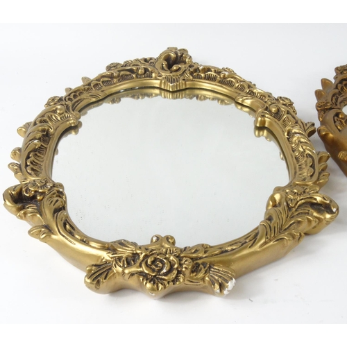 27 - Two ornate gilt framed wall hanging mirrors, each 63cm x 45 cm