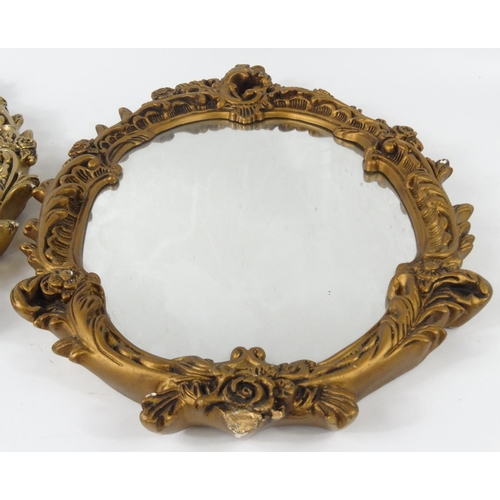 27 - Two ornate gilt framed wall hanging mirrors, each 63cm x 45 cm