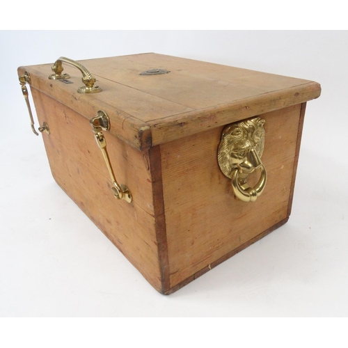 122 - Pine box with brass lion head handles and a silver football interest plaque to the lid, 57cm long