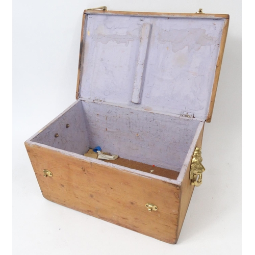 122 - Pine box with brass lion head handles and a silver football interest plaque to the lid, 57cm long