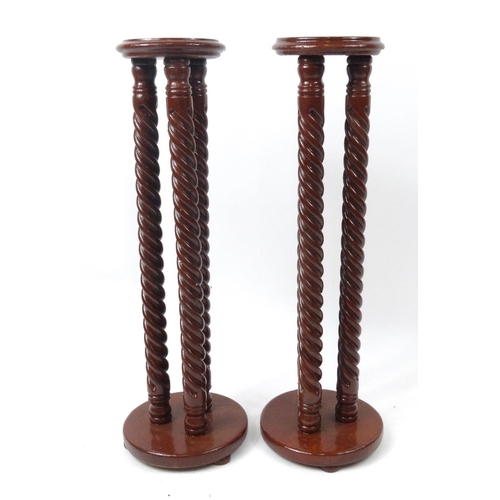 90 - Pair of spiral twist wooden plant stands, 88cm high