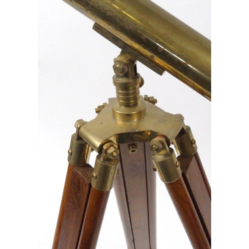 628 - Brass and wooden floor standing telescope