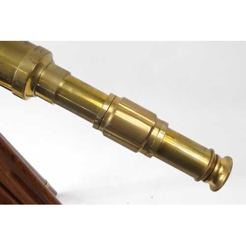 628 - Brass and wooden floor standing telescope