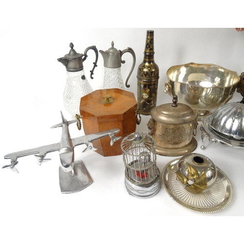 521 - Two boxes of metal ware, including brass caskets, miners lamps, silver plated items, claret jugs, a ... 