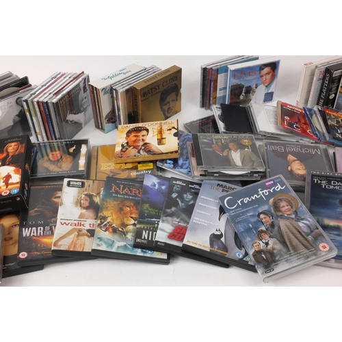 526 - Box of assorted CD's and DVD's including boxed sets of 24