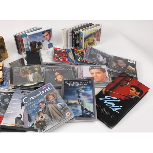 526 - Box of assorted CD's and DVD's including boxed sets of 24