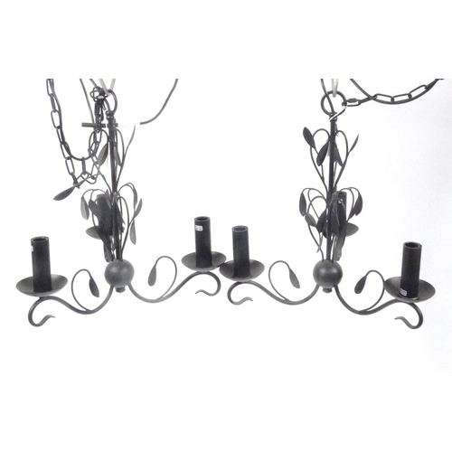 163 - Pair of black metal three branch chandeliers, 45cm high excluding the chain