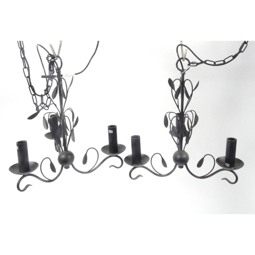 163 - Pair of black metal three branch chandeliers, 45cm high excluding the chain