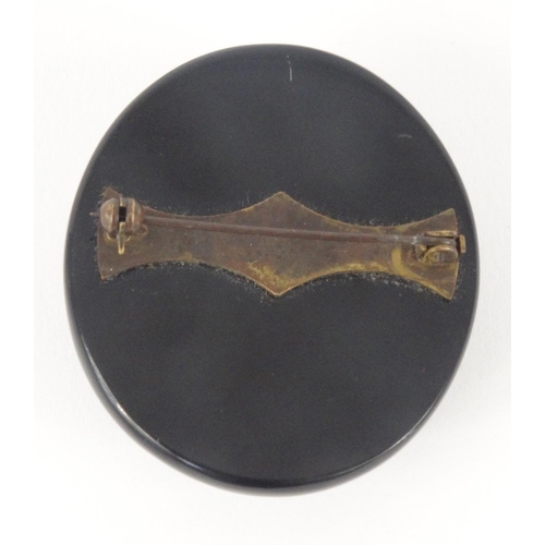 376 - Jet style maiden head brooch, 5cm high