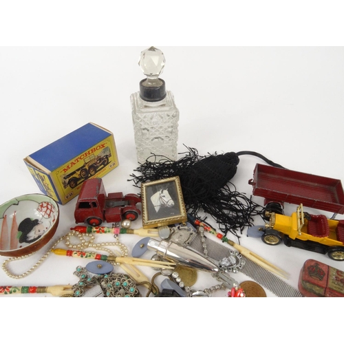 411 - Bag of objects including Corgi die cast Tom and Jerry vehicles, vintage Medex wristwatch, costume je... 