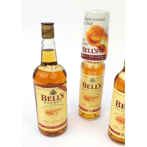 2207 - Four bottles of Bell's old Scotch whisky, including two 1lt bottles and two 70cl bottles
