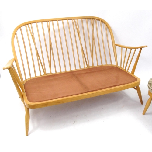 2054 - Ercol light elm stick back two seater settee with matching stool, each with checked upholstered cush... 