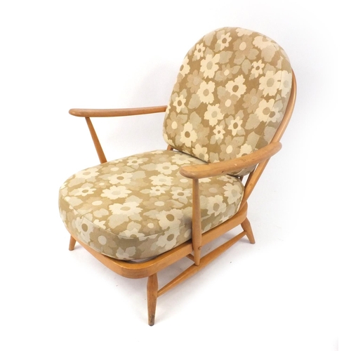 2055 - Ercol light elm stick back arm chair with floral upholstered cushions, 86cm high