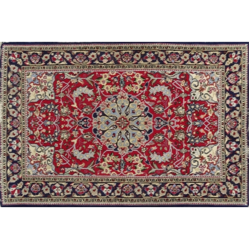 63 - Blue ground geometric floral patterned rug with Persian  rug world label, approximately 160cm x 107c... 