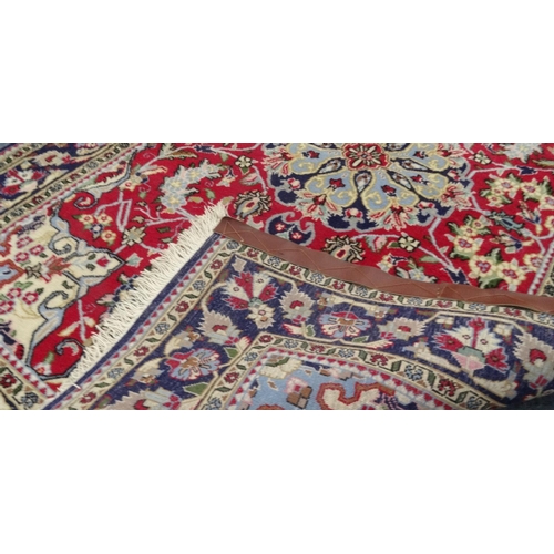 63 - Blue ground geometric floral patterned rug with Persian  rug world label, approximately 160cm x 107c... 