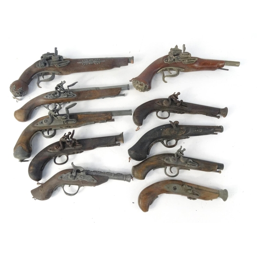 642 - Ten decorative flint lock pistols