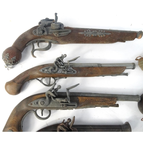 642 - Ten decorative flint lock pistols