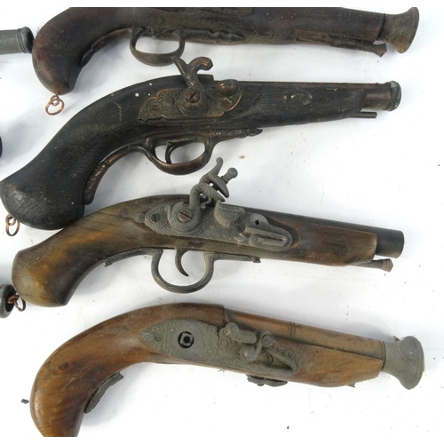 642 - Ten decorative flint lock pistols