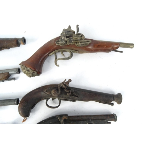 642 - Ten decorative flint lock pistols