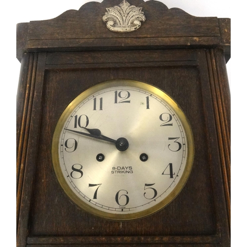 474 - Oak cased eight day striking wall clock with visible pendulum, 62cm high